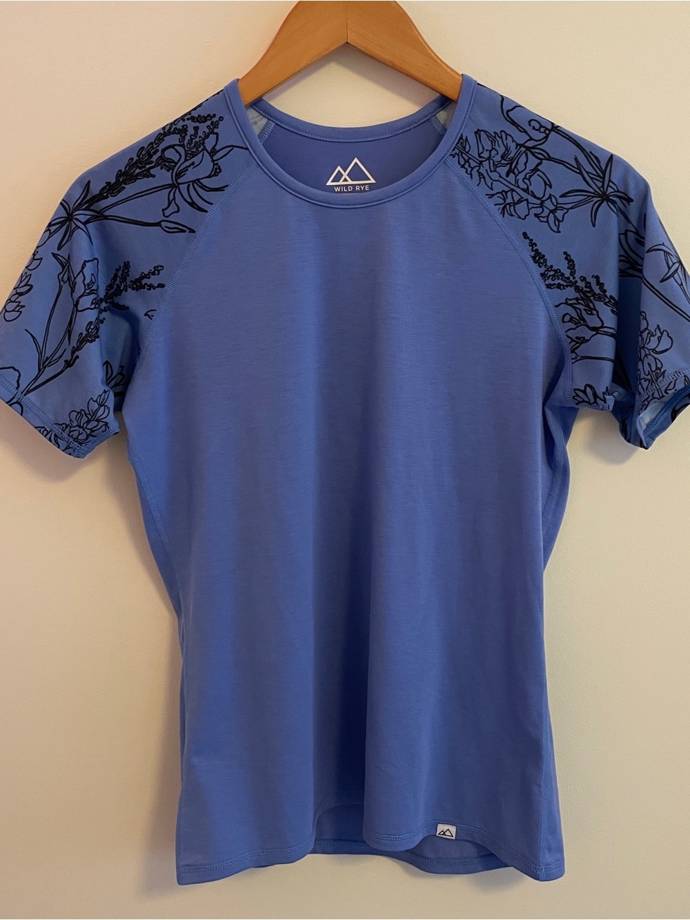 Wild Rye Women's Blue Short Sleeve Athletic Top with Floral Sleeves
